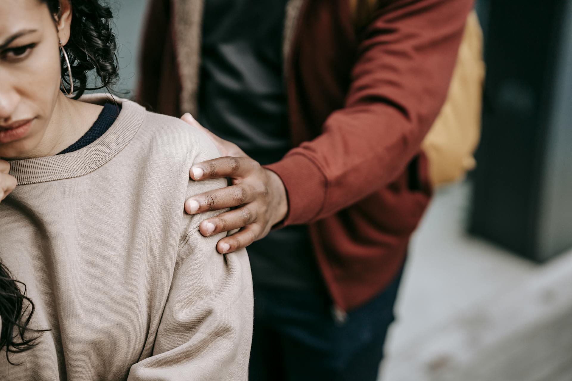 partner comforting stressed woman